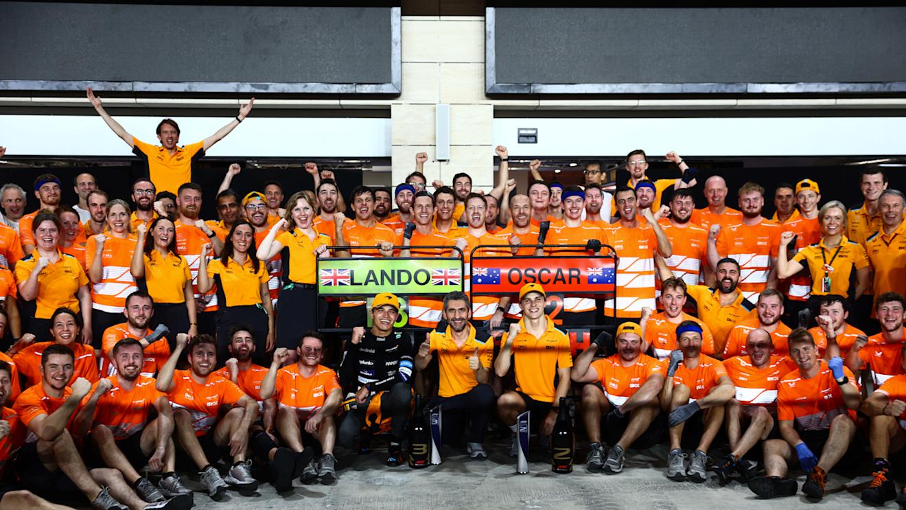 LUSAIL CITY, QATAR - OCTOBER 08: Second placed Oscar Piastri of Australia and McLaren and Third placed Lando Norris of Great Britain and McLaren celebrate with their team after the F1 Grand Prix of Qatar at Lusail International Circuit on October 08, 2023 in Lusail City, Qatar. (Photo by Clive Rose/Getty Images)
