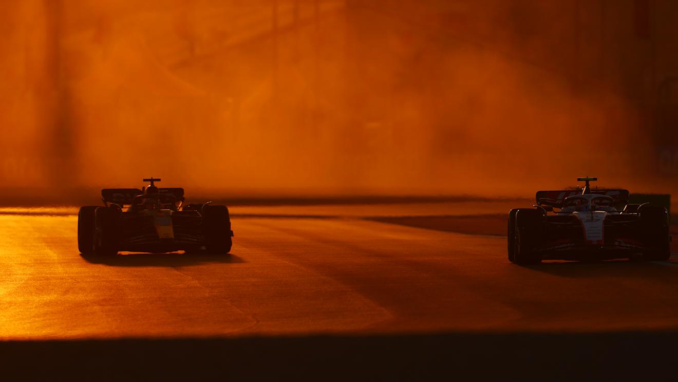 LUSAIL CITY, QATAR - OCTOBER 06: Nico Hulkenberg of Germany driving the (27) Haas F1 VF-23 Ferrari and Max Verstappen of the Netherlands driving the (1) Oracle Red Bull Racing RB19 on track during practice ahead of the F1 Grand Prix of Qatar at Lusail International Circuit on October 06, 2023 in Lusail City, Qatar. (Photo by Mark Thompson/Getty Images)