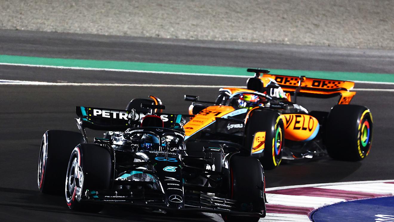 LUSAIL CITY, QATAR - OCTOBER 07: George Russell of Great Britain driving the (63) Mercedes AMG Petronas F1 Team W14 leads Oscar Piastri of Australia driving the (81) McLaren MCL60 Mercedes  during the Sprint ahead of the F1 Grand Prix of Qatar at Lusail International Circuit on October 07, 2023 in Lusail City, Qatar. (Photo by Clive Rose/Getty Images)