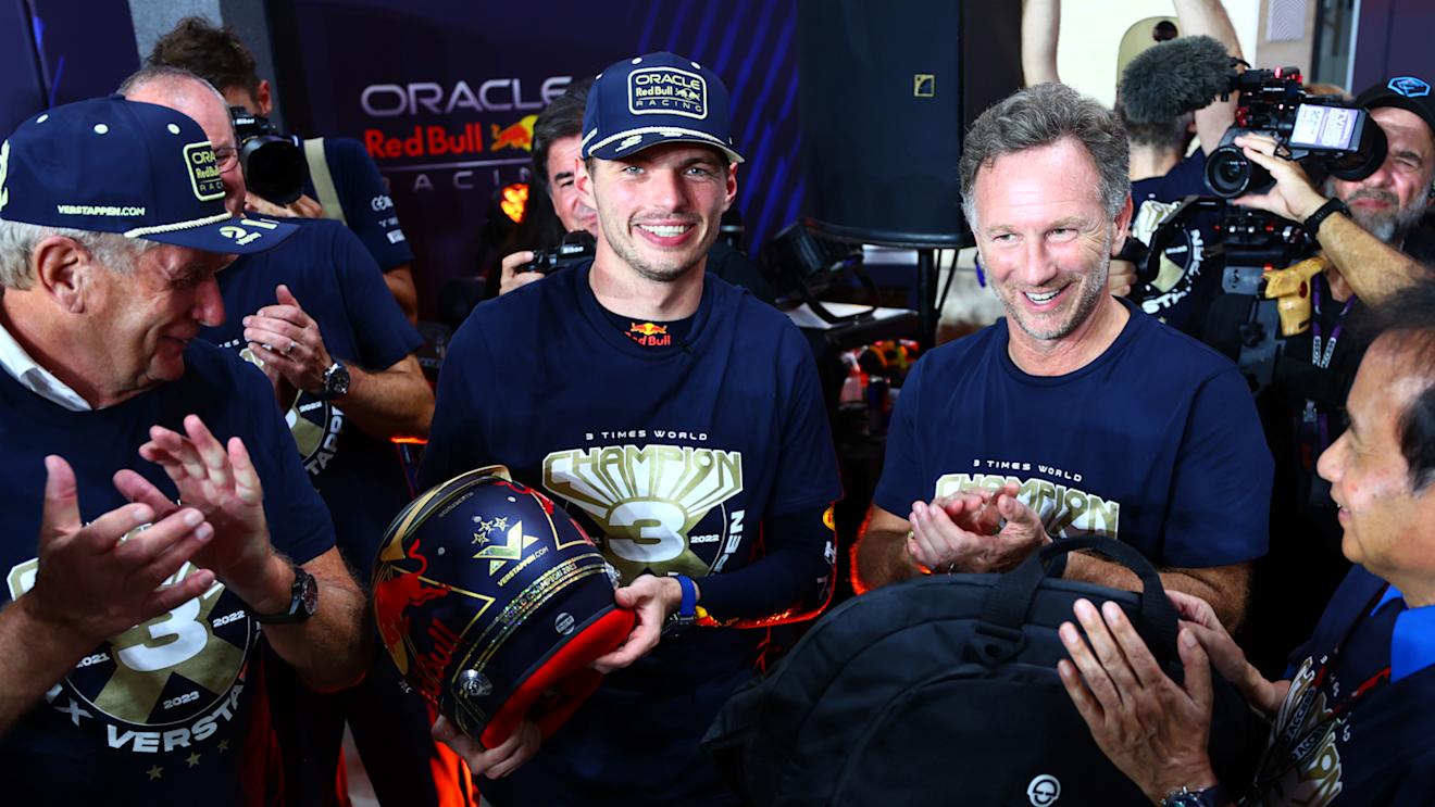 LUSAIL CITY, QATAR - OCTOBER 07: 2023 F1 World Drivers Champion Max Verstappen of the Netherlands and Oracle Red Bull Racing is congratulted by Red Bull Racing Team Principal Christian Horner , Chalerm Yoovidhya and Red Bull Racing Team Consultant Dr Helmut Marko as he is presented with a celebratory helmet after the sprint race ahead of the F1 Grand Prix of Qatar at Lusail International Circuit on October 07, 2023 in Lusail City, Qatar. (Photo by Dan Istitene - Formula 1/Formula 1 via Getty Images)
