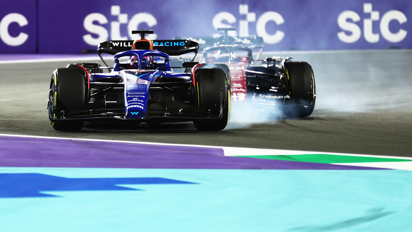 JEDDAH, SAUDI ARABIA - MARCH 19: Alexander Albon of Thailand driving the (23) Williams FW45 Mercedes locks a wheel under braking in front of Valtteri Bottas of Finland driving the (77) Alfa Romeo F1 C43 Ferrari during the F1 Grand Prix of Saudi Arabia at Jeddah Corniche Circuit on March 19, 2023 in Jeddah, Saudi Arabia. (Photo by Dan Istitene - Formula 1/Formula 1 via Getty Images)