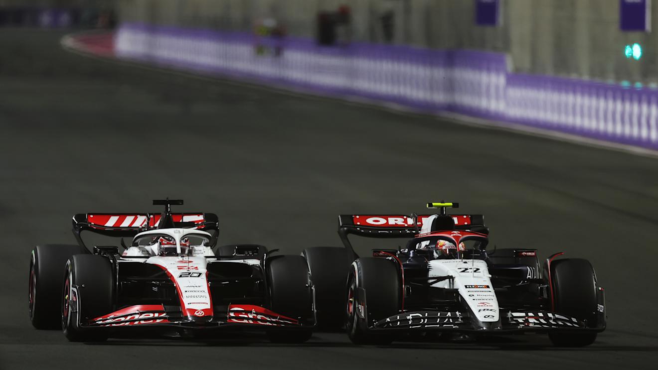 JEDDAH, SAUDI ARABIA - MARCH 19: Yuki Tsunoda of Japan driving the (22) Scuderia AlphaTauri AT04 leads Kevin Magnussen of Denmark driving the (20) Haas F1 VF-23 Ferrari during the F1 Grand Prix of Saudi Arabia at Jeddah Corniche Circuit on March 19, 2023 in Jeddah, Saudi Arabia. (Photo by Lars Baron/Getty Images)