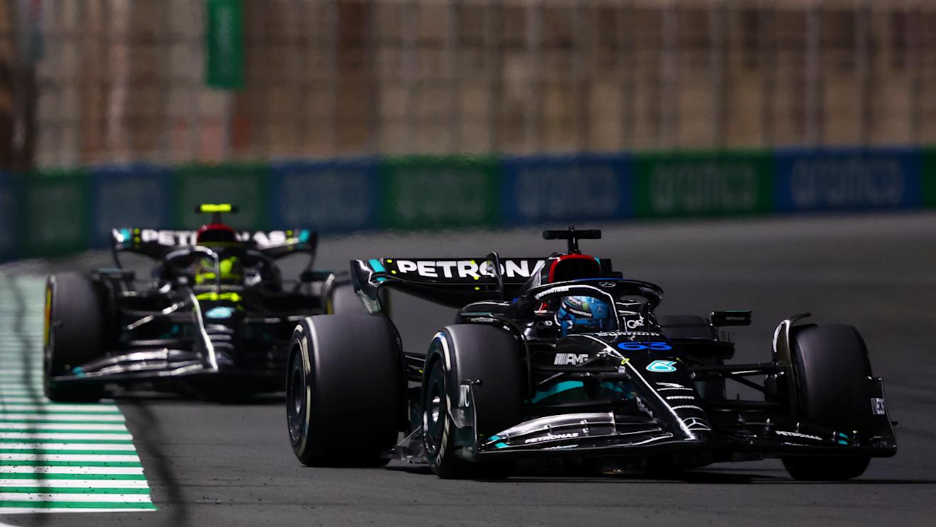 JEDDAH, SAUDI ARABIA - MARCH 19: George Russell of Great Britain driving the (63) Mercedes AMG Petronas F1 Team W14 leads Lewis Hamilton of Great Britain and Mercedes during the F1 Grand Prix of Saudi Arabia at Jeddah Corniche Circuit on March 19, 2023 in Jeddah, Saudi Arabia. (Photo by Bryn Lennon - Formula 1/Formula 1 via Getty Images)