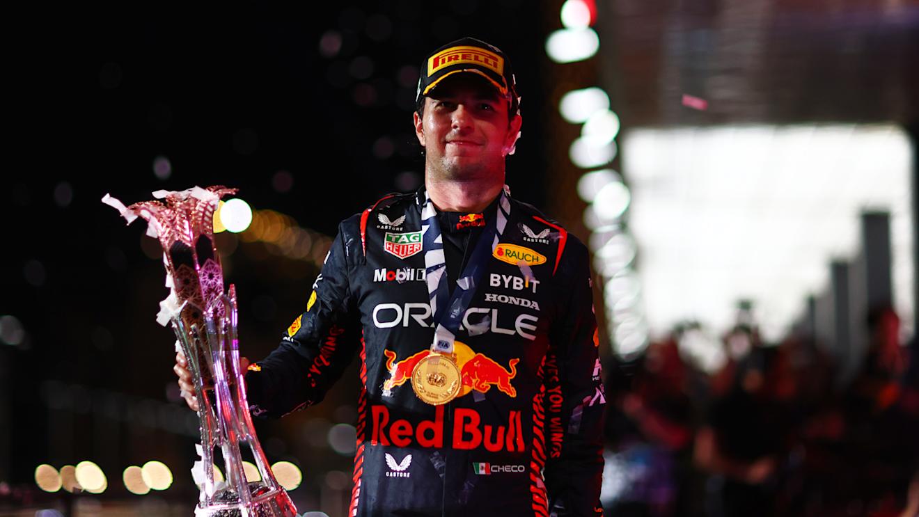JEDDAH, SAUDI ARABIA - MARCH 19: Race winner Sergio Perez of Mexico and Oracle Red Bull Racing celebrates on the podium during the F1 Grand Prix of Saudi Arabia at Jeddah Corniche Circuit on March 19, 2023 in Jeddah, Saudi Arabia. (Photo by Dan Istitene - Formula 1/Formula 1 via Getty Images)