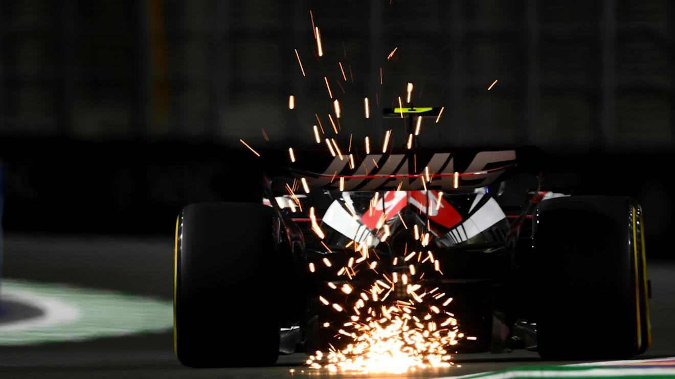 JEDDAH, SAUDI ARABIA - MARCH 17: Sparks fly behind Nico Hulkenberg of Germany driving the (27) Haas F1 VF-23 Ferrari during practice ahead of the F1 Grand Prix of Saudi Arabia at Jeddah Corniche Circuit on March 17, 2023 in Jeddah, Saudi Arabia. (Photo by Clive Mason/Getty Images)