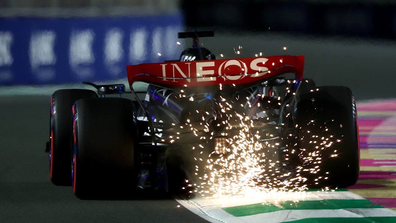 JEDDAH, SAUDI ARABIA - MARCH 18: Sparks fly behind George Russell of Great Britain driving the (63) Mercedes AMG Petronas F1 Team W14 during qualifying ahead of the F1 Grand Prix of Saudi Arabia at Jeddah Corniche Circuit on March 18, 2023 in Jeddah, Saudi Arabia. (Photo by Bryn Lennon - Formula 1/Formula 1 via Getty Images)