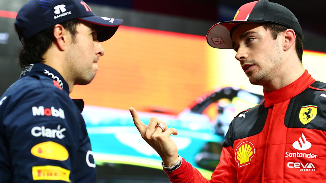 JEDDAH, SAUDI ARABIA - MARCH 18: Pole position qualifier Sergio Perez of Mexico and Oracle Red Bull Racing speaks to second place qualifier Charles Leclerc of Monaco and Ferrari in parc ferme after qualifying ahead of the F1 Grand Prix of Saudi Arabia at Jeddah Corniche Circuit on March 18, 2023 in Jeddah, Saudi Arabia. (Photo by Dan Istitene - Formula 1/Formula 1 via Getty Images)