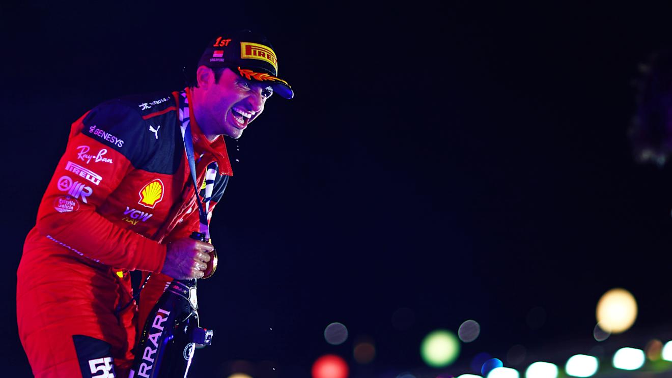 SINGAPORE, SINGAPORE - SEPTEMBER 17: Race winner Carlos Sainz of Spain and Ferrari celebrates on the podium during the F1 Grand Prix of Singapore at Marina Bay Street Circuit on September 17, 2023 in Singapore, Singapore. (Photo by Dan Istitene - Formula 1/Formula 1 via Getty Images)