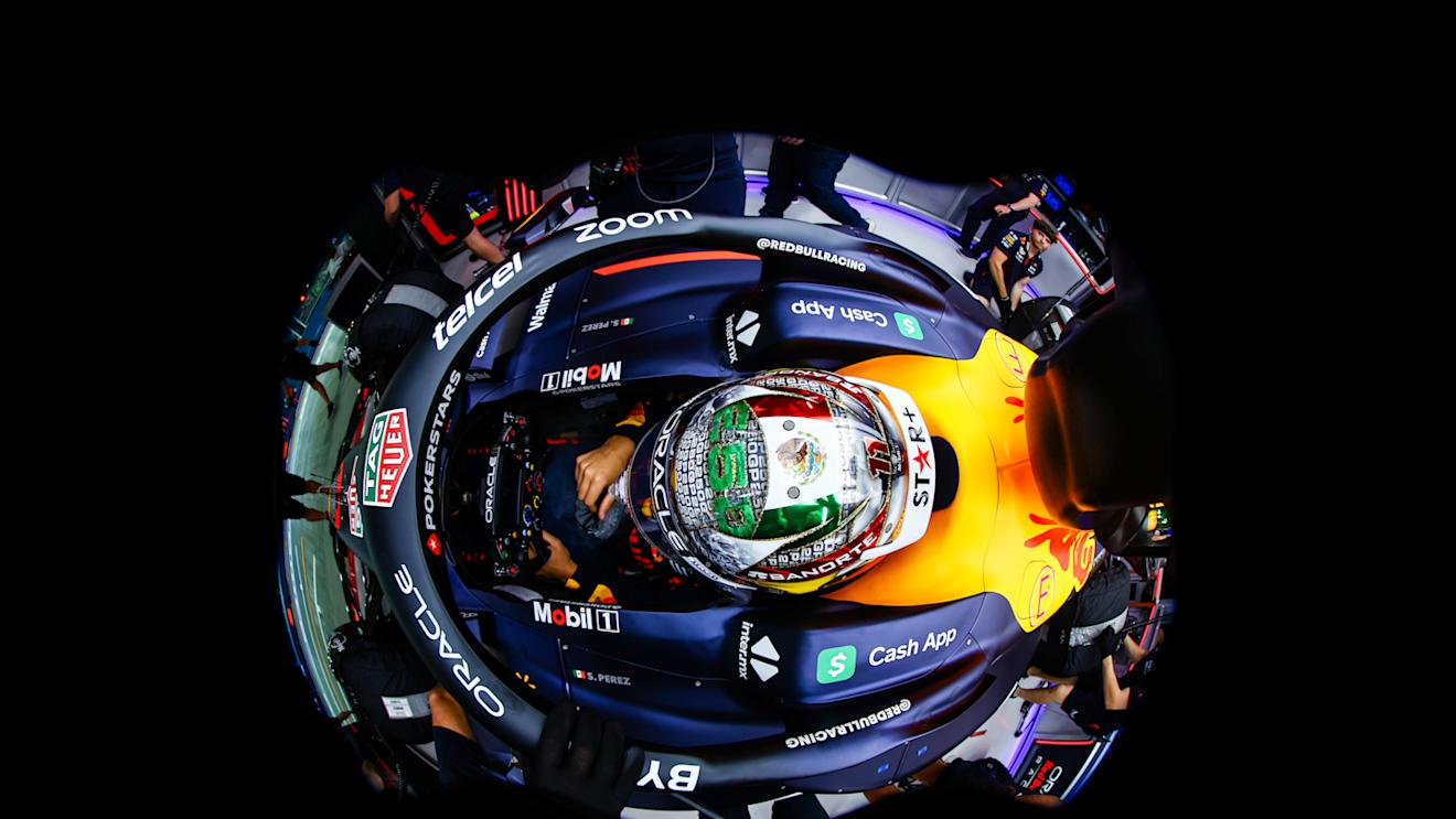 SINGAPORE, SINGAPORE - SEPTEMBER 16: Sergio Perez of Mexico and Oracle Red Bull Racing prepares to drive in the garage prior to qualifying ahead of the F1 Grand Prix of Singapore at Marina Bay Street Circuit on September 16, 2023 in Singapore, Singapore. (Photo by Mark Thompson/Getty Images)