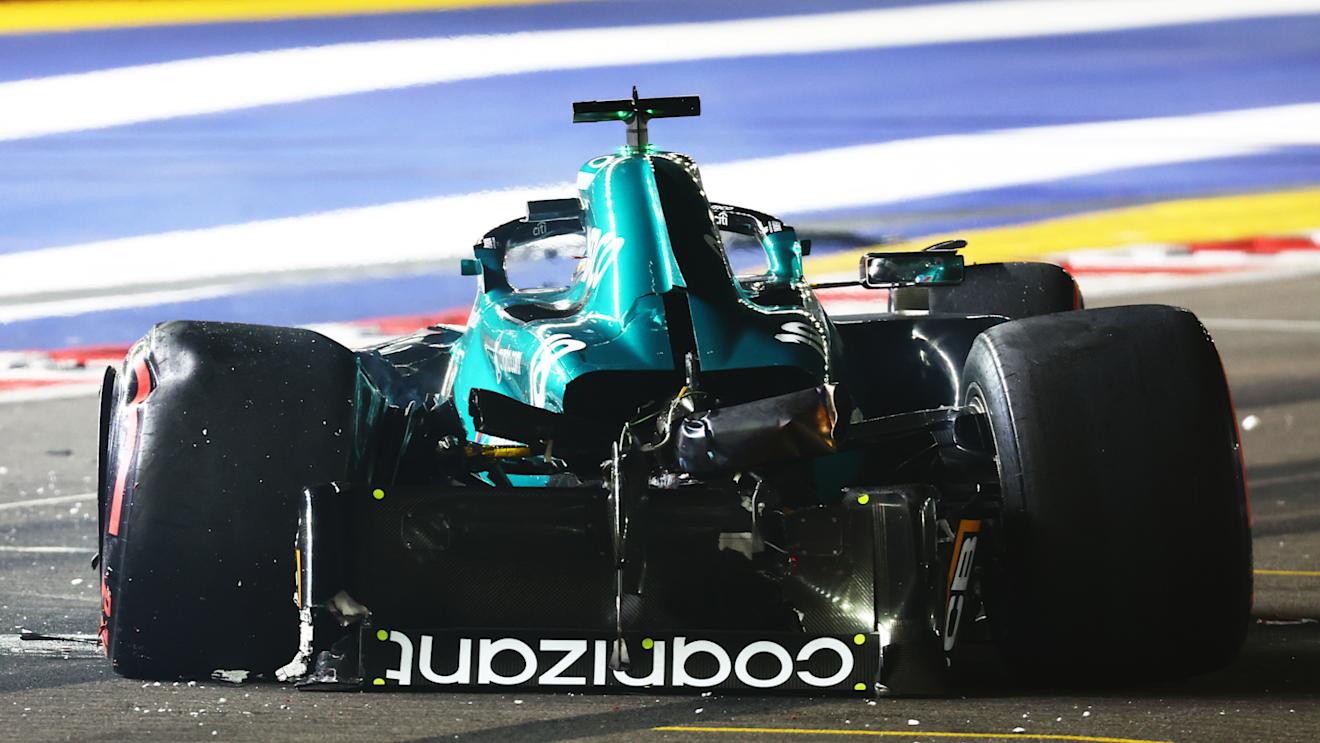 SINGAPORE, SINGAPORE - SEPTEMBER 16: Lance Stroll of Canada and Aston Martin F1 Team sits in his car after crashing on track during qualifying ahead of the F1 Grand Prix of Singapore at Marina Bay Street Circuit on September 16, 2023 in Singapore, Singapore. (Photo by Mark Thompson/Getty Images)