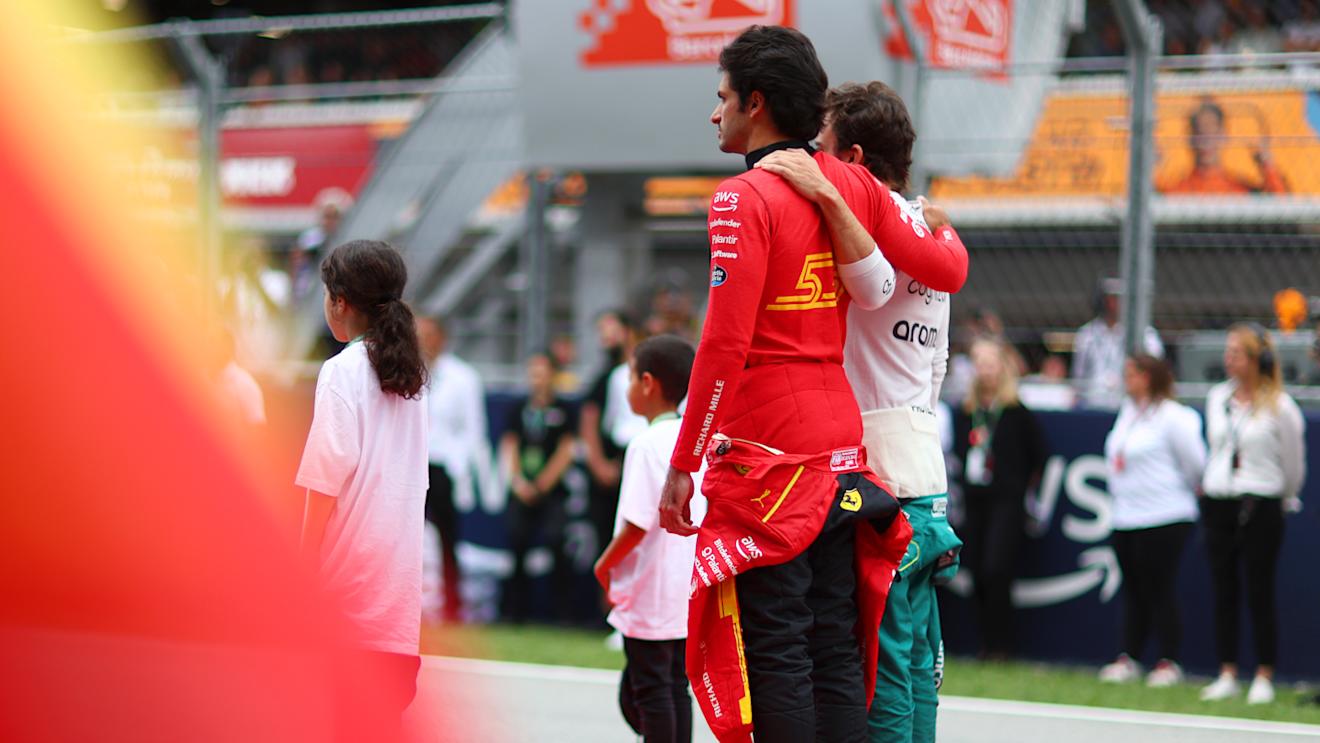 BARCELONA, SPAIN - JUNE 04: Carlos Sainz of Spain and Ferrari and Fernando Alonso of Spain and Aston Martin F1 Team interact on the grid prior to the F1 Grand Prix of Spain at Circuit de Barcelona-Catalunya on June 04, 2023 in Barcelona, Spain. (Photo by Dan Istitene - Formula 1/Formula 1 via Getty Images)