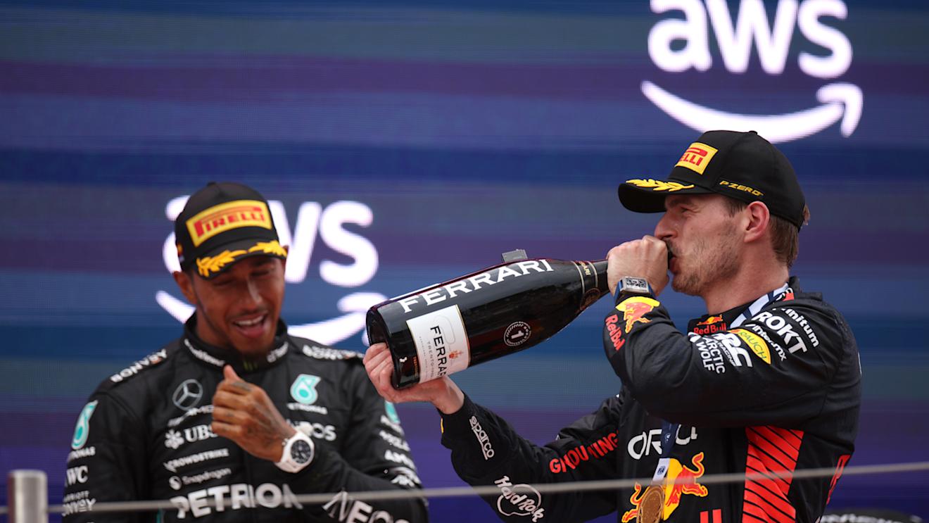 BARCELONA, SPAIN - JUNE 04: Race winner Max Verstappen of the Netherlands and Oracle Red Bull Racing and Second placed Lewis Hamilton of Great Britain and Mercedes celebrate on the podium during the F1 Grand Prix of Spain at Circuit de Barcelona-Catalunya on June 04, 2023 in Barcelona, Spain. (Photo by Adam Pretty/Getty Images)