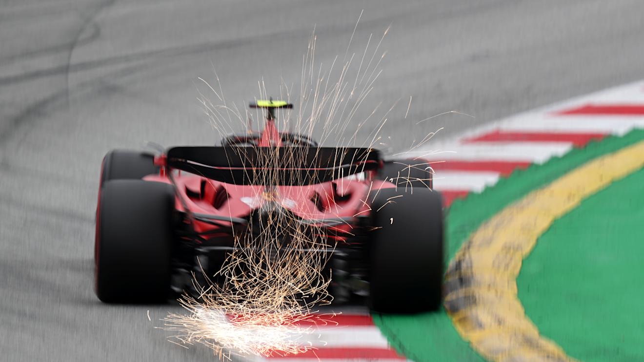BARCELONA, SPAIN - JUNE 03: Sparks fly behind Carlos Sainz of Spain driving (55) the Ferrari SF-23 on track during qualifying ahead of the F1 Grand Prix of Spain at Circuit de Barcelona-Catalunya on June 03, 2023 in Barcelona, Spain. (Photo by David Ramos/Getty Images)