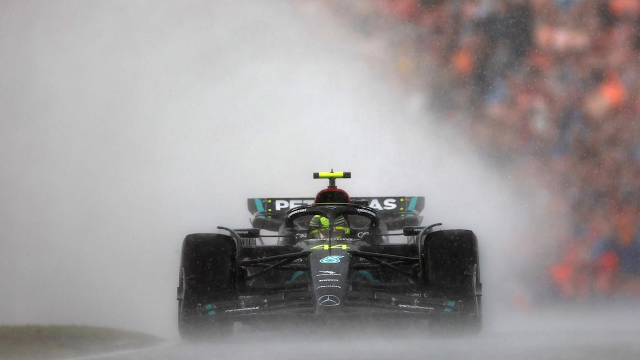 ZANDVOORT, NETHERLANDS - AUGUST 27: Lewis Hamilton of Great Britain driving the (44) Mercedes AMG Petronas F1 Team W14 in the rain during the F1 Grand Prix of The Netherlands at Circuit Zandvoort on August 27, 2023 in Zandvoort, Netherlands. (Photo by Lars Baron/Getty Images)