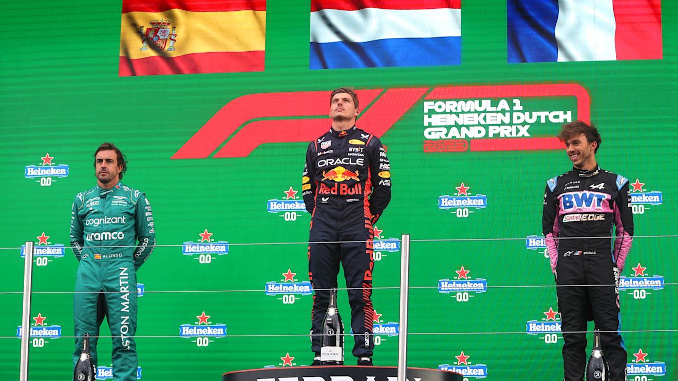 ZANDVOORT, NETHERLANDS - AUGUST 27: Race winner Max Verstappen of the Netherlands and Oracle Red Bull Racing, Second placed Fernando Alonso of Spain and Aston Martin F1 Team, Third placed Pierre Gasly of France and Alpine F1 and Edward Aveling, Chief Designer at Red Bull Racing celebrate on the podium during the F1 Grand Prix of The Netherlands at Circuit Zandvoort on August 27, 2023 in Zandvoort, Netherlands. (Photo by Peter Fox/Getty Images)