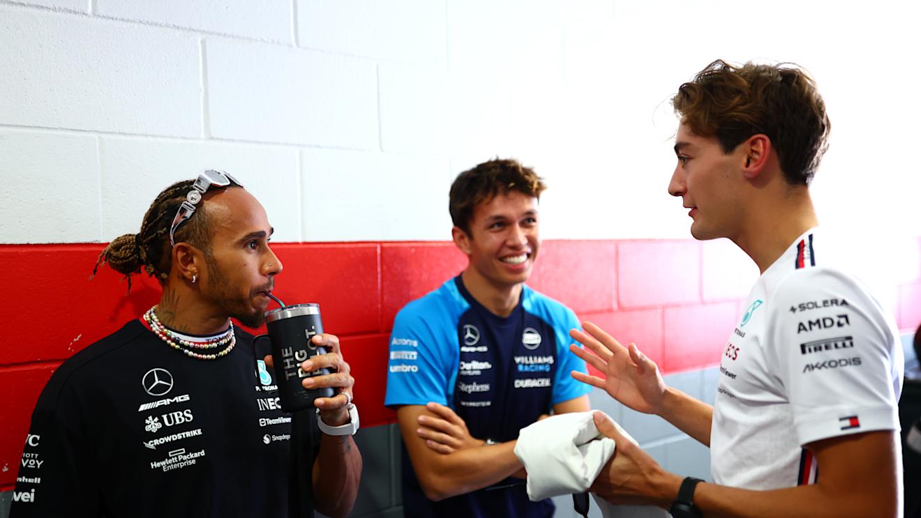 AUSTIN, TEXAS - OCTOBER 22: Lewis Hamilton of Great Britain and Mercedes speaks to George Russell of Great Britain and Mercedes and Alexander Albon of Thailand and Williams in the Pitlane prior to the F1 Grand Prix of United States at Circuit of The Americas on October 22, 2023 in Austin, Texas. (Photo by Dan Istitene - Formula 1/Formula 1 via Getty Images)