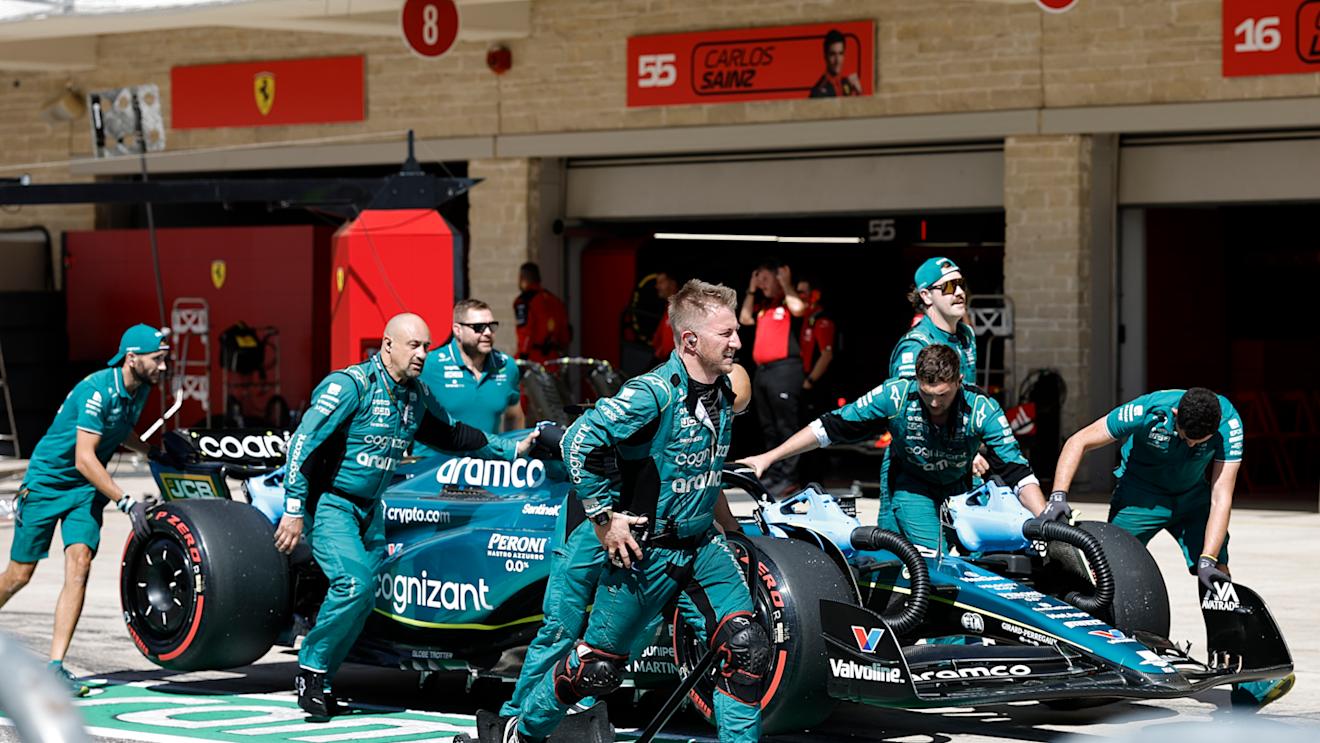 AUSTIN, TEXAS - OCTOBER 22: Aston Martin mechanics push Lance Stroll of Canada and Aston Martin F1 Team in the Pitlane prior to the F1 Grand Prix of United States at Circuit of The Americas on October 22, 2023 in Austin, Texas. (Photo by Chris Graythen/Getty Images)