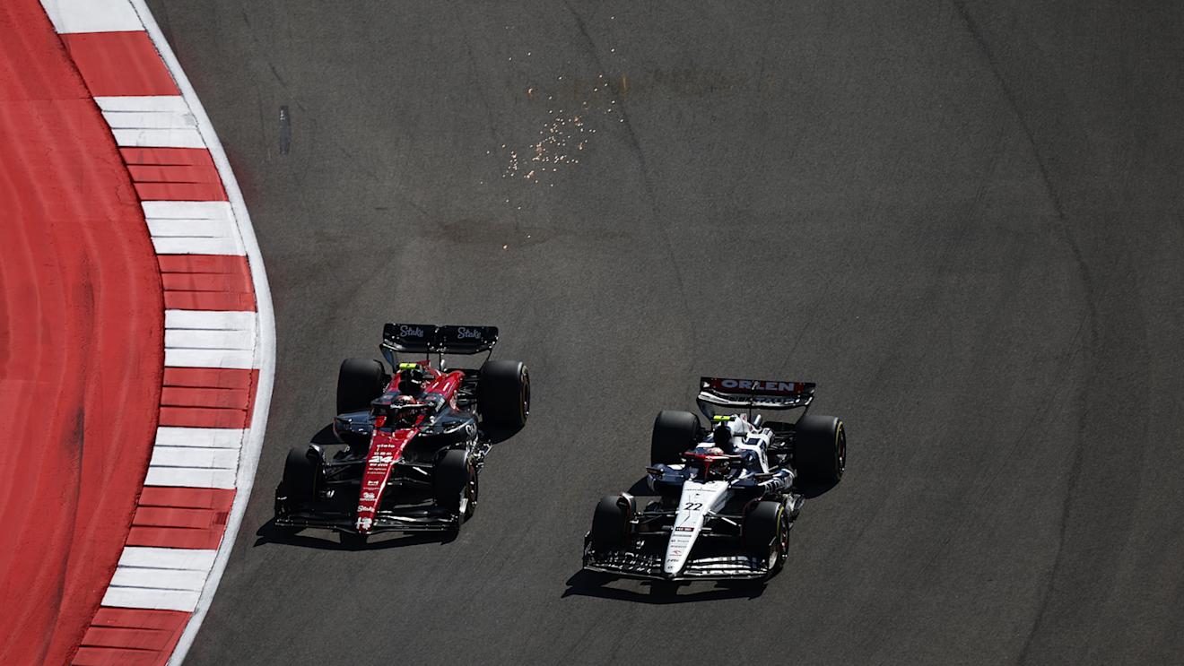 AUSTIN, TEXAS - OCTOBER 22: Zhou Guanyu of China driving the (24) Alfa Romeo F1 C43 Ferrari and Yuki Tsunoda of Japan driving the (22) Scuderia AlphaTauri AT04 battle for position during the F1 Grand Prix of United States at Circuit of The Americas on October 22, 2023 in Austin, Texas. (Photo by Jared C. Tilton - Formula 1/Formula 1 via Getty Images)
