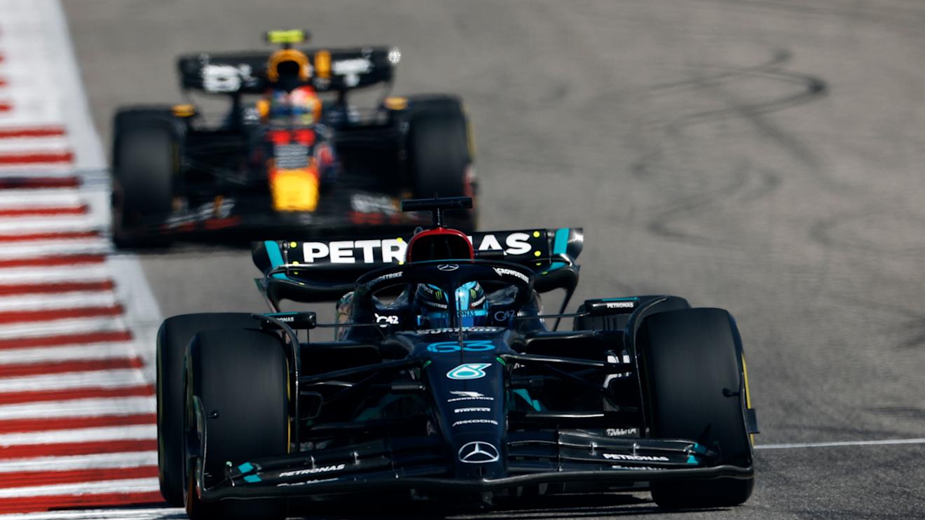 AUSTIN, TEXAS - OCTOBER 22: George Russell of Great Britain driving the (63) Mercedes AMG Petronas F1 Team W14 leads Sergio Perez of Mexico driving the (11) Oracle Red Bull Racing RB19 on track during the F1 Grand Prix of United States at Circuit of The Americas on October 22, 2023 in Austin, Texas. (Photo by Chris Graythen/Getty Images)