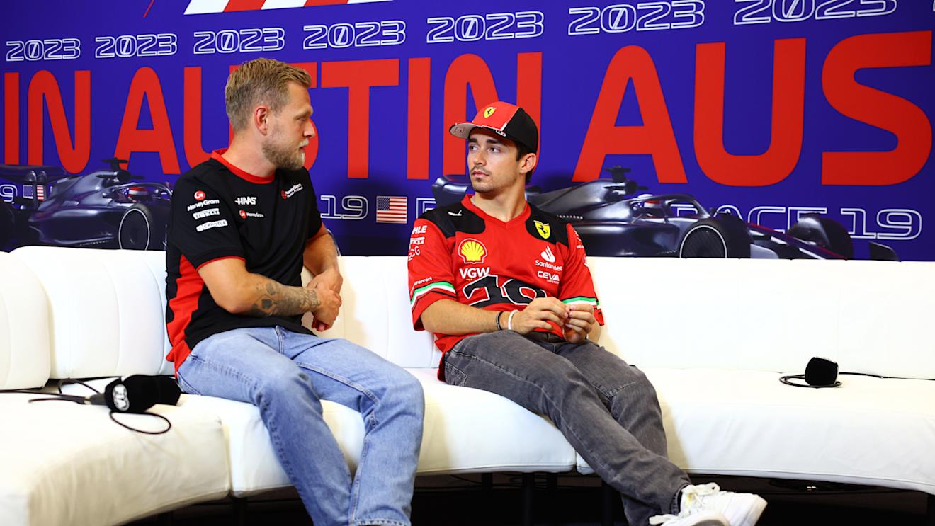 AUSTIN, TEXAS - OCTOBER 19: Kevin Magnussen of Denmark and Haas F1 and Charles Leclerc of Monaco and Ferrari talk in the Drivers Press Conference during previews ahead of the F1 Grand Prix of United States at Circuit of The Americas on October 19, 2023 in Austin, Texas. (Photo by Dan Istitene/Getty Images)