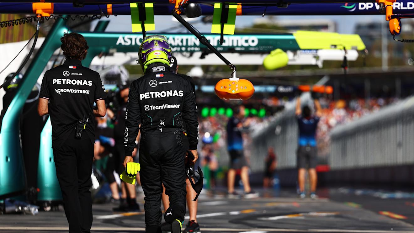 MELBOURNE, AUSTRALIA - MARCH 23: 11th placed qualifier Lewis Hamilton of Great Britain and Mercedes walks in the Pitlane during qualifying ahead of the F1 Grand Prix of Australia at Albert Park Circuit on March 23, 2024 in Melbourne, Australia. (Photo by Mark Thompson/Getty Images)