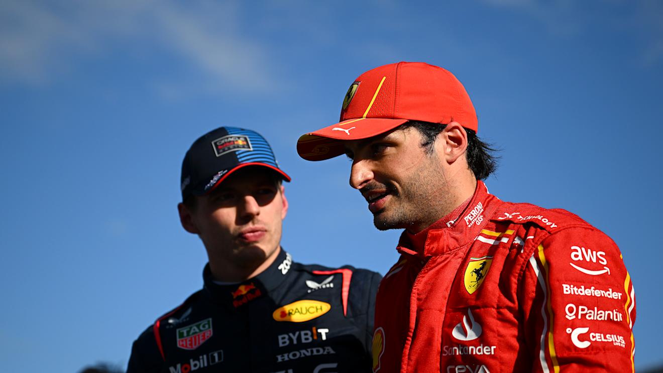 MELBOURNE, AUSTRALIA - MARCH 23: Second placed qualifier Carlos Sainz of Spain and Ferrari and Pole position qualifier Max Verstappen of the Netherlands and Oracle Red Bull Racing talk in parc ferme during qualifying ahead of the F1 Grand Prix of Australia at Albert Park Circuit on March 23, 2024 in Melbourne, Australia. (Photo by Clive Mason - Formula 1/Formula 1 via Getty Images)