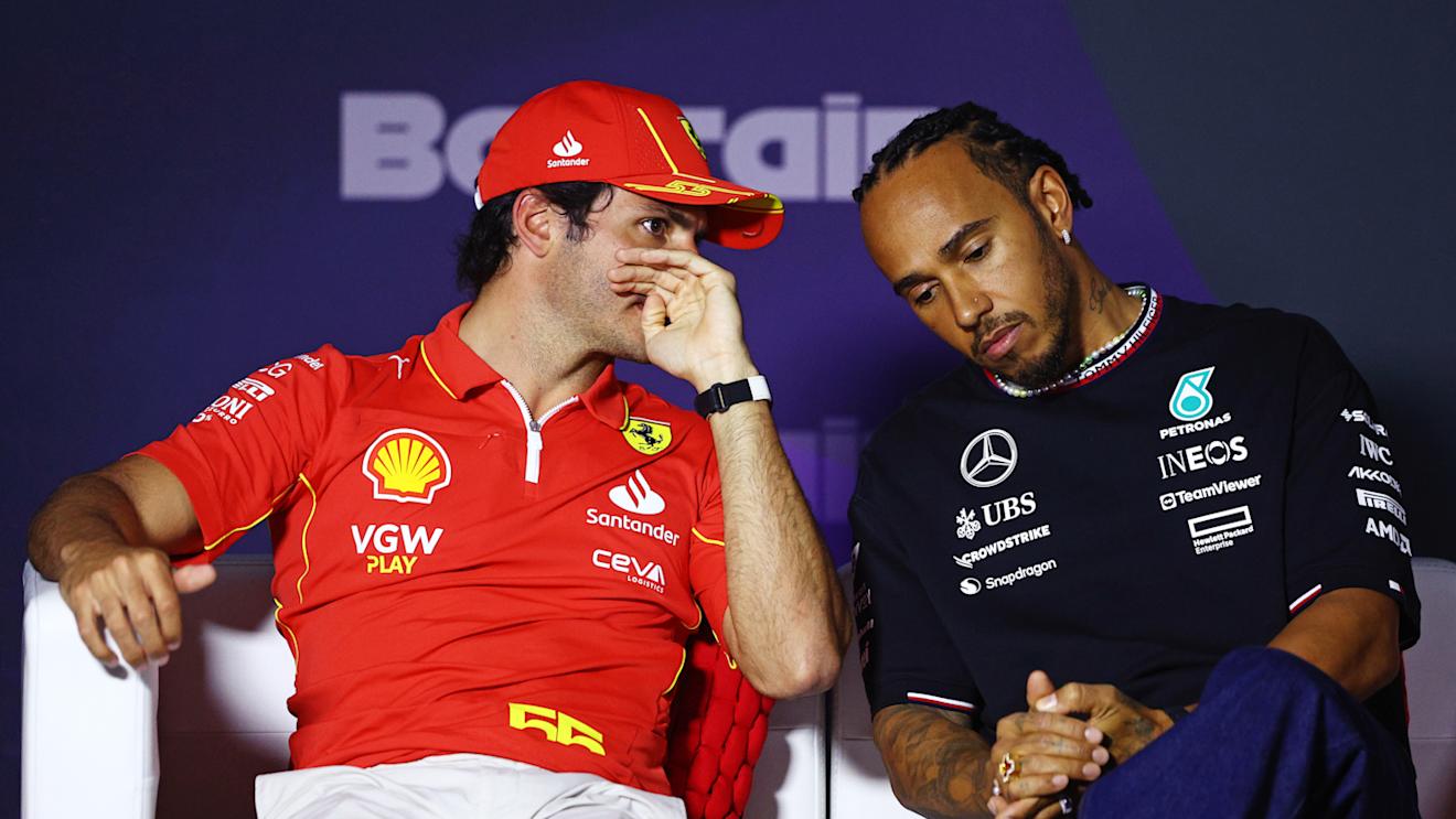 BAHRAIN, BAHRAIN - FEBRUARY 28: Carlos Sainz of Spain and Ferrari and Lewis Hamilton of Great Britain and Mercedes attend the Drivers Press Conference during previews ahead of the F1 Grand Prix of Bahrain at Bahrain International Circuit on February 28, 2024 in Bahrain, Bahrain. (Photo by Clive Rose/Getty Images)