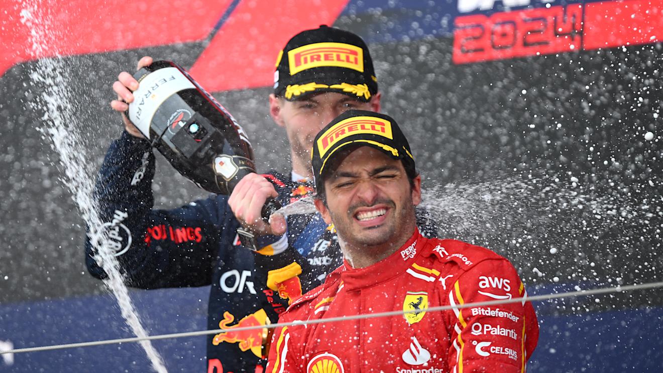 SUZUKA, JAPAN - APRIL 07: Race winner Max Verstappen of the Netherlands and Oracle Red Bull Racing and Third placed Carlos Sainz of Spain and Ferrari celebrate on the podium during the F1 Grand Prix of Japan at Suzuka International Racing Course on April 07, 2024 in Suzuka, Japan. (Photo by Clive Mason/Getty Images)