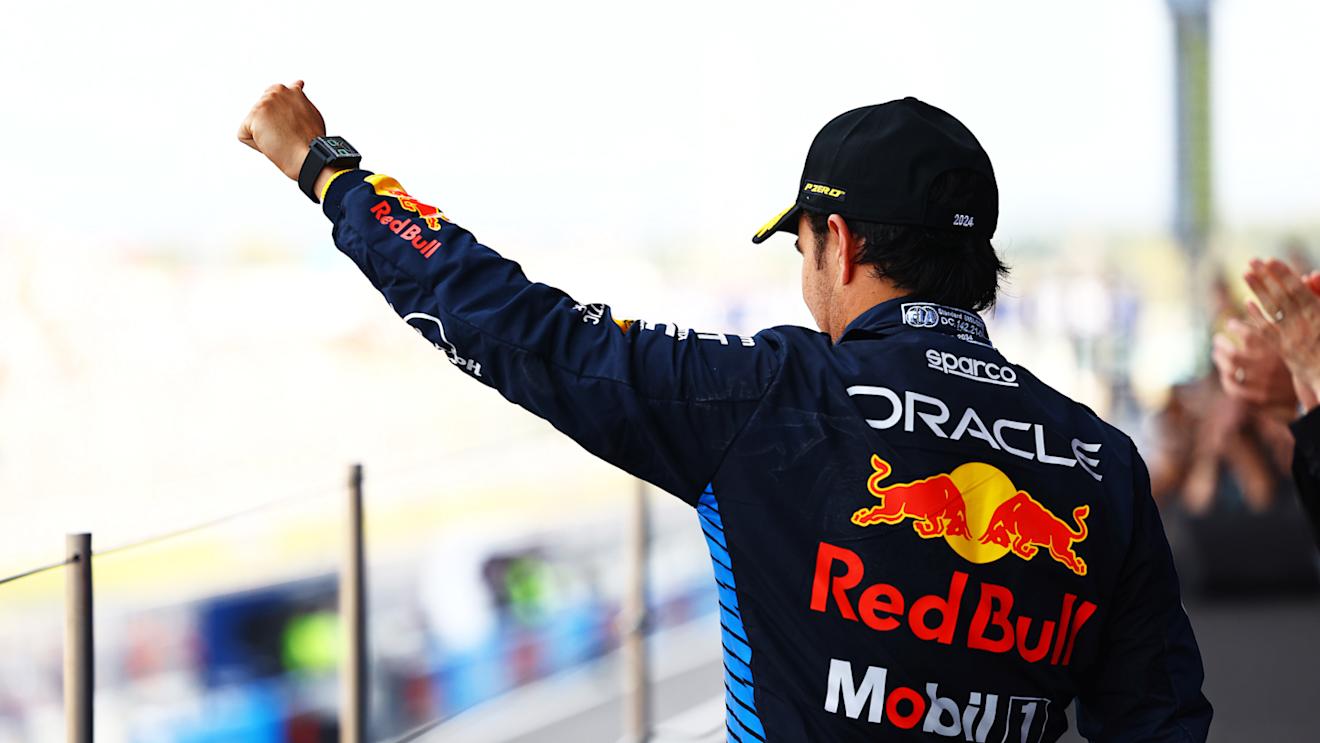 SUZUKA, JAPAN - APRIL 07: Second placed Sergio Perez of Mexico and Oracle Red Bull Racing celebrates on the podium during the F1 Grand Prix of Japan at Suzuka International Racing Course on April 07, 2024 in Suzuka, Japan. (Photo by Mark Thompson/Getty Images)