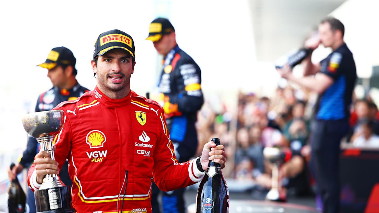 SUZUKA, JAPAN - APRIL 07: Third placed Carlos Sainz of Spain and Ferrari celebrates on the podium during the F1 Grand Prix of Japan at Suzuka International Racing Course on April 07, 2024 in Suzuka, Japan. (Photo by Mark Thompson/Getty Images)