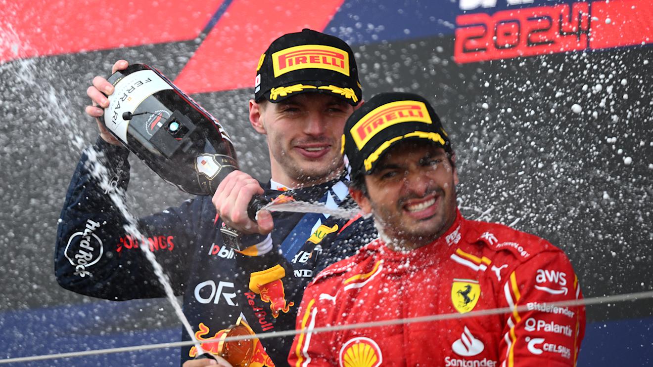 SUZUKA, JAPAN - APRIL 07: Race winner Max Verstappen of the Netherlands and Oracle Red Bull Racing and Third placed Carlos Sainz of Spain and Ferrari celebrate on the podium during the F1 Grand Prix of Japan at Suzuka International Racing Course on April 07, 2024 in Suzuka, Japan. (Photo by Clive Mason/Getty Images)