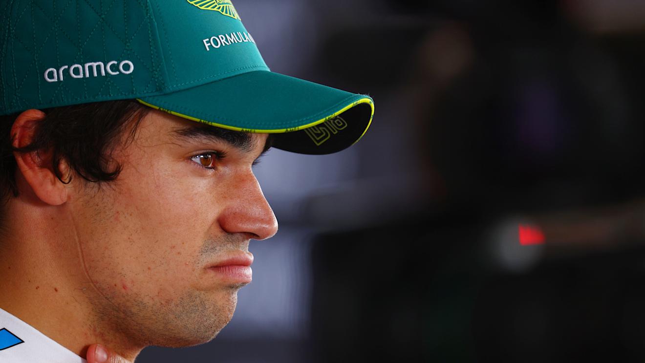 SUZUKA, JAPAN - APRIL 06: 16th placed qualifier Lance Stroll of Canada and Aston Martin F1 Team looks on in the Paddock during qualifying ahead of the F1 Grand Prix of Japan at Suzuka International Racing Course on April 06, 2024 in Suzuka, Japan. (Photo by Clive Rose - Formula 1/Formula 1 via Getty Images)