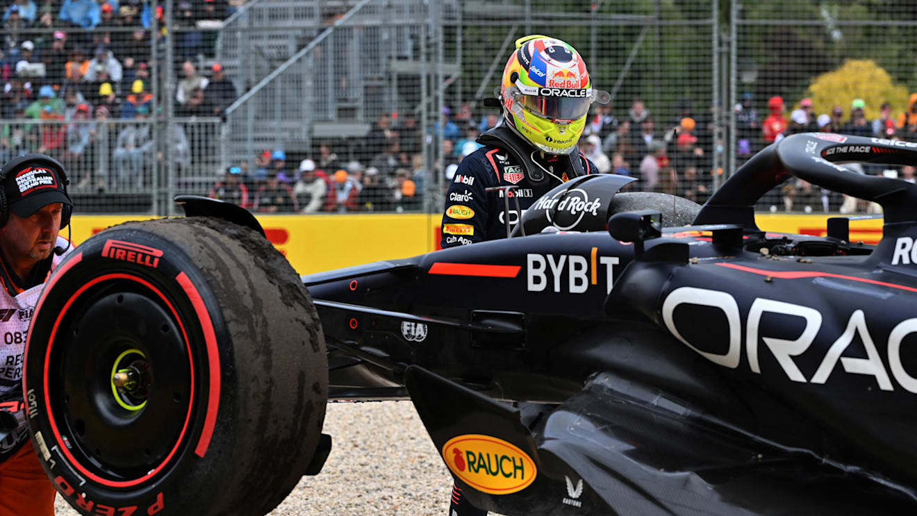 Red Bull Racing's Mexican driver Sergio Perez looks on as marshals remove his car from the side of the track during the qualifying round of the 2023 Formula One Australian Grand Prix at the Albert Park Circuit in Melbourne on April 1, 2023. (Photo by Paul CROCK / AFP) / -- IMAGE RESTRICTED TO EDITORIAL USE - STRICTLY NO COMMERCIAL USE -- (Photo by PAUL CROCK/AFP via Getty Images)
