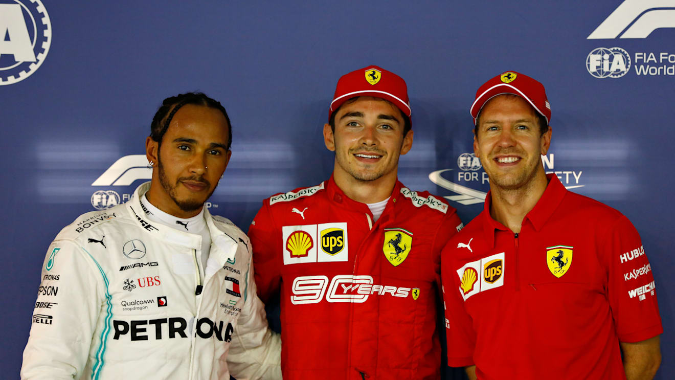 SINGAPORE, SINGAPORE - SEPTEMBER 21: Top three qualifiers Charles Leclerc of Monaco and Ferrari, Lewis Hamilton of Great Britain and Mercedes GP and Sebastian Vettel of Germany and Ferrari celebrate in parc ferme during qualifying for the F1 Grand Prix of Singapore at Marina Bay Street Circuit on September 21, 2019 in Singapore. (Photo by Will Taylor-Medhurst/Getty Images)
