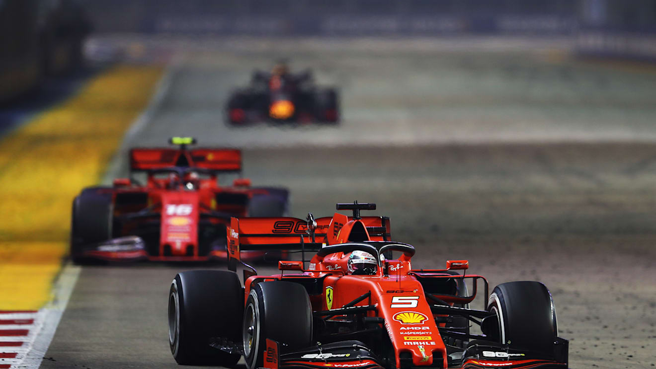 SINGAPORE, SINGAPORE - SEPTEMBER 22: Sebastian Vettel of Germany driving the (5) Scuderia Ferrari SF90 leads Charles Leclerc of Monaco driving the (16) Scuderia Ferrari SF90 on track during the F1 Grand Prix of Singapore at Marina Bay Street Circuit on September 22, 2019 in Singapore. (Photo by Lars Baron/Getty Images)