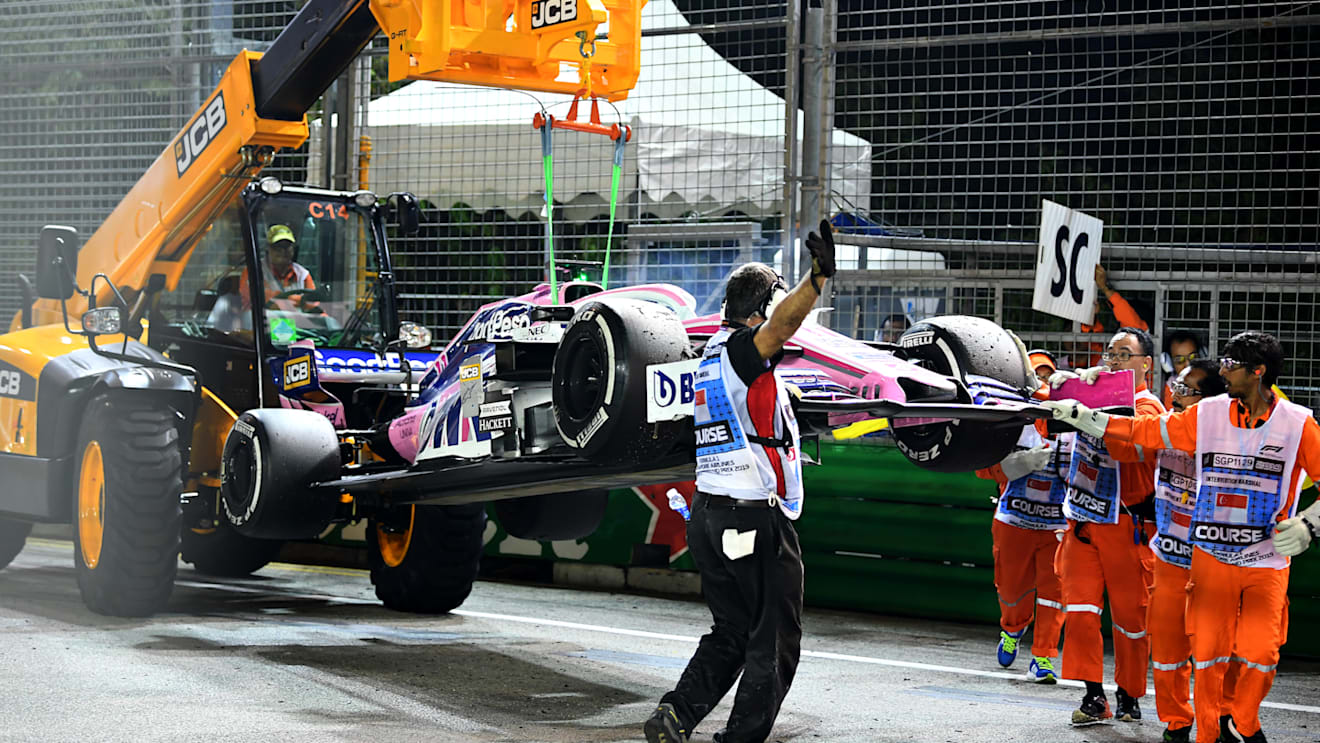 SINGAPORE, SINGAPORE - SEPTEMBER 22: The car of Sergio Perez of Mexico and Racing Point is removed from the circuit after he retired during the F1 Grand Prix of Singapore at Marina Bay Street Circuit on September 22, 2019 in Singapore. (Photo by Clive Mason/Getty Images)