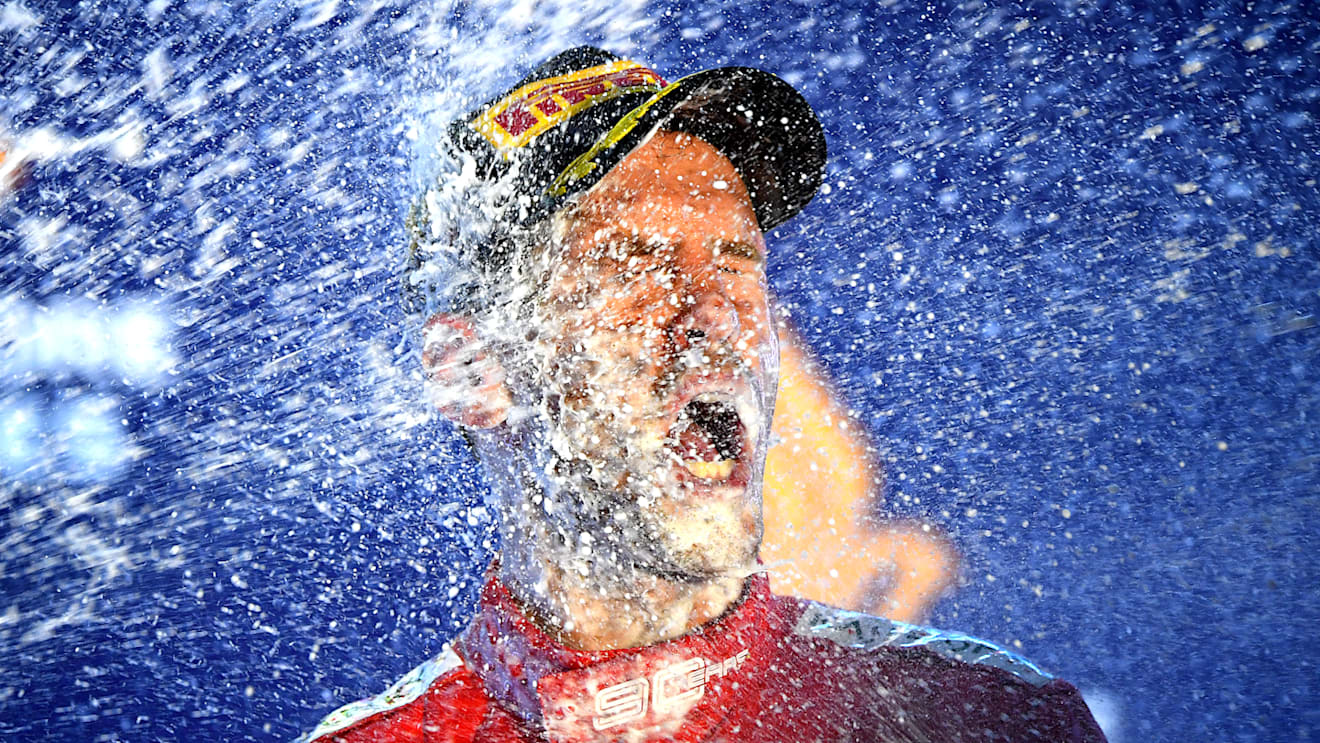 SINGAPORE, SINGAPORE - SEPTEMBER 22: Race winner Sebastian Vettel of Germany and Ferrari celebrates on the podium during the F1 Grand Prix of Singapore at Marina Bay Street Circuit on September 22, 2019 in Singapore. (Photo by Clive Mason/Getty Images)
