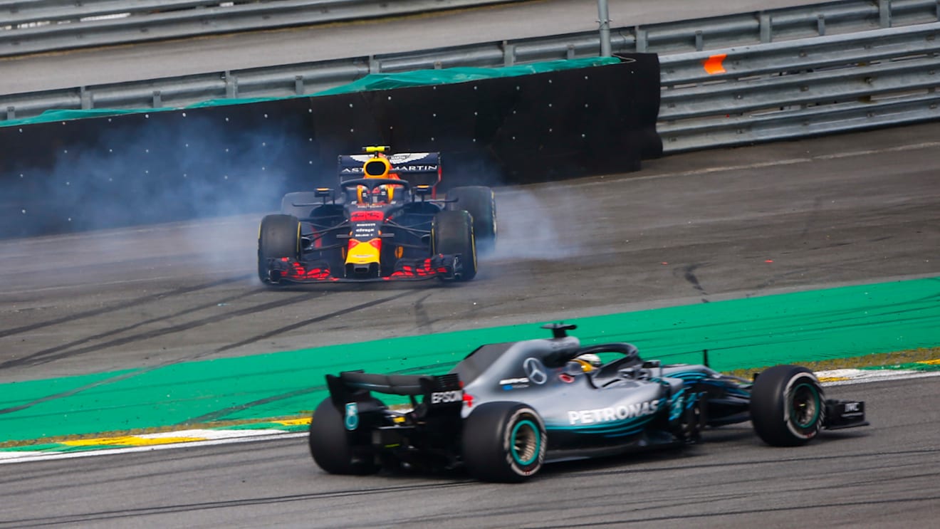 AUTóDROMO JOSé CARLOS PACE, BRAZIL - NOVEMBER 11: Lewis Hamilton, Mercedes AMG F1 W09, passes a spinning Max Verstappen, Red Bull Racing RB14 Tag Heuer, after the latter suffers a collision with Esteban Ocon, Force India VJM11 Mercedes during the Brazilian GP at Autódromo José Carlos Pace on November 11, 2018 in Autódromo José Carlos Pace, Brazil. (Photo by Andy Hone / LAT Images)