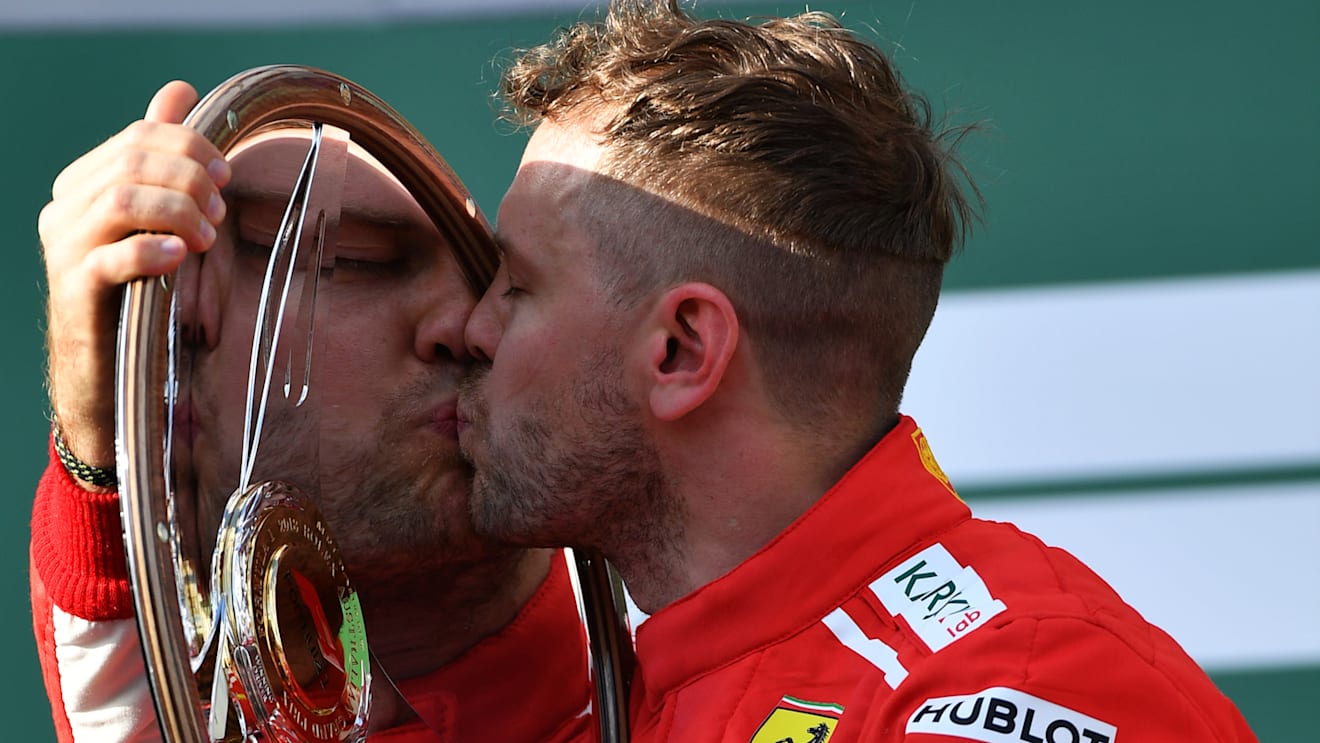 www.sutton-images.com Race winner Sebastian Vettel (GER) Ferrari celebrates on the podium with the trophy at Formula One World Championship, Rd1, Australian Grand Prix, Race, Melbourne, Australia, Sunday 25 March 2018. © Sutton Images,Sutton Images