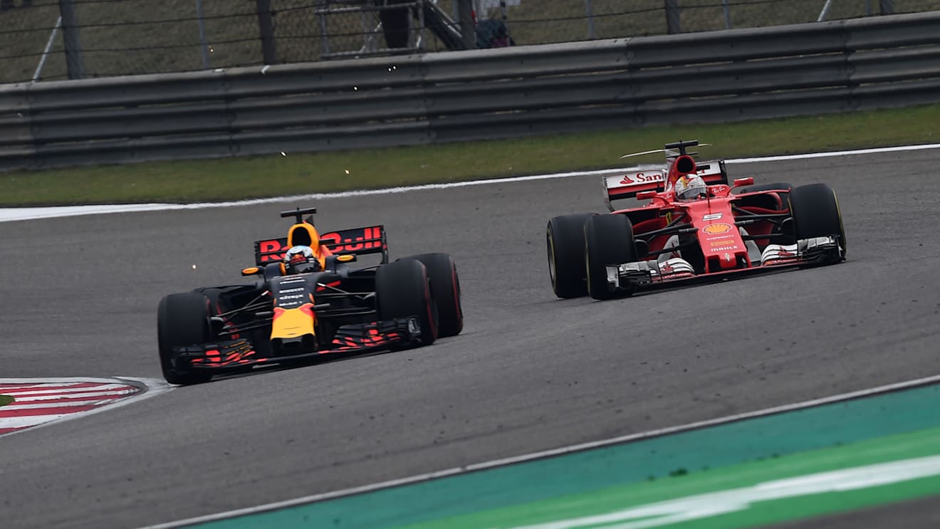 Sebastian Vettel (GER) Ferrari SF70-H and Daniel Ricciardo (AUS) Red Bull Racing RB13 battle at Formula One World Championship, Rd2, Chinese Grand Prix, Race, Shanghai, China, Sunday 9 April 2017. © Sutton Motorsport Images
