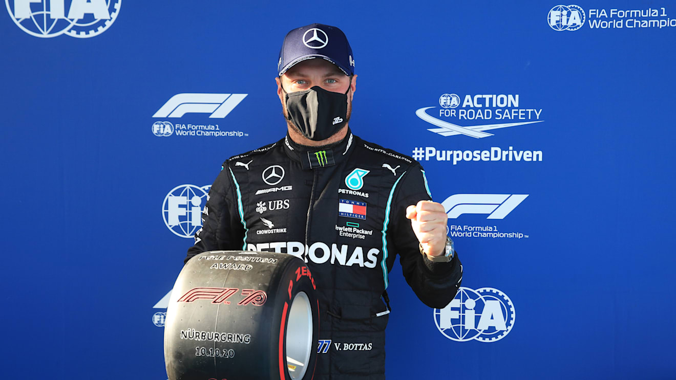NUERBURG, GERMANY - OCTOBER 10: Pole position qualifier Valtteri Bottas of Finland and Mercedes GP celebrates in parc ferme during qualifying ahead of the F1 Eifel Grand Prix at Nuerburgring on October 10, 2020 in Nuerburg, Germany. (Photo by Wolfgang Rattay - Pool/Getty Images)