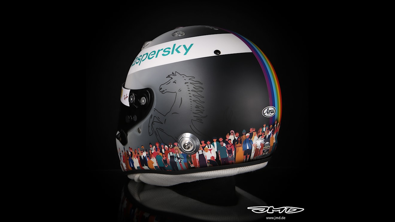 The Ferrari logo is still on the helmet, which fades from white to black
