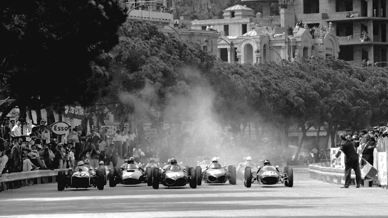 On pole in the left is Moss's privately entered Lotus 18, while Jim Clark (R) had a brand-new factory Lotus 21.