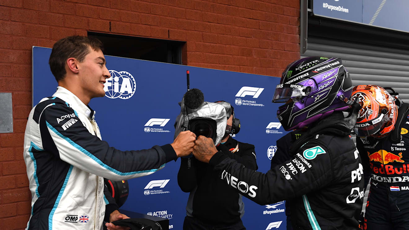 SPA, BELGIUM - AUGUST 28: Second place qualifier George Russell of Great Britain and Williams and third place qualifier Lewis Hamilton of Great Britain and Mercedes GP celebrate in parc ferme during qualifying ahead of the F1 Grand Prix of Belgium at Circuit de Spa-Francorchamps on August 28, 2021 in Spa, Belgium. (Photo by John Thys - Pool/Getty Images)