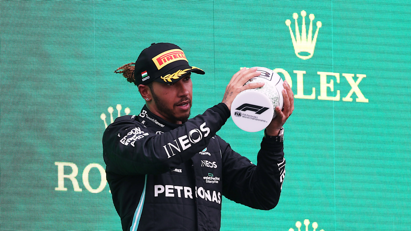 BUDAPEST, HUNGARY - AUGUST 01: Third placed Lewis Hamilton of Great Britain and Mercedes GP celebrates on the podium during the F1 Grand Prix of Hungary at Hungaroring on August 01, 2021 in Budapest, Hungary. (Photo by Lars Baron/Getty Images)