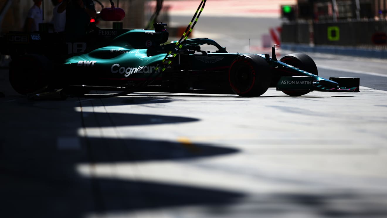 The Aston Martin's AMR21 engine 'bulge' visible as Stroll pulls out of the garage