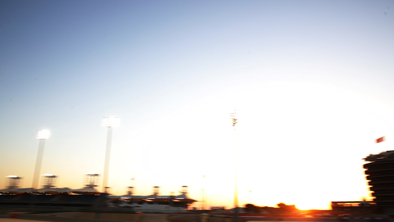 A wide-angled shot of Mazepin driving into the sunset