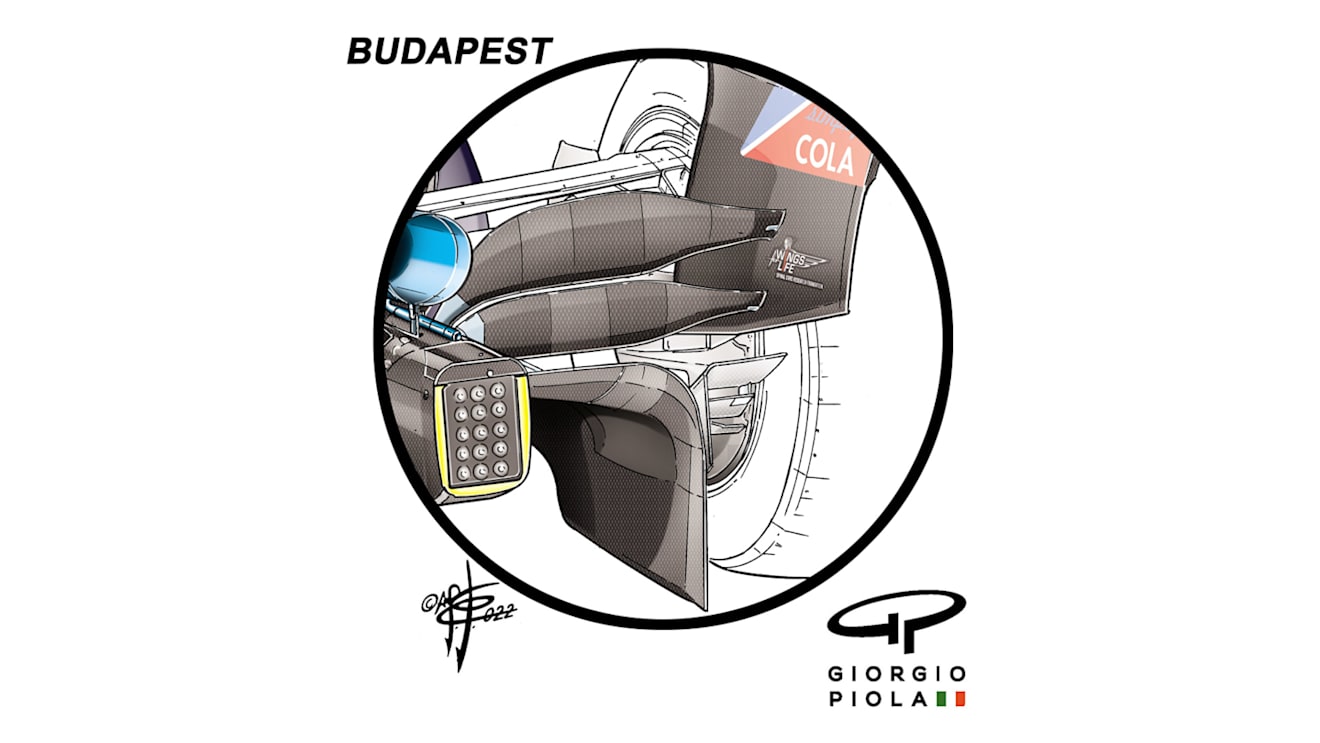 … So when the driver lifts the throttle, the wastegate will be boosting airflow. As they stand on the throttle and the wastegate is no longer in use, there will be a small downforce change. Above is a close-up of the Hungary-spec beam wing: the high-downforce beam wing used by Red Bull at Budapest. The upper element has a greatly increased angle, creating downforce of its own. The wastegate pipe exit can be seen here, directing gases over the diffuser at high speed thanks to its small diameter.