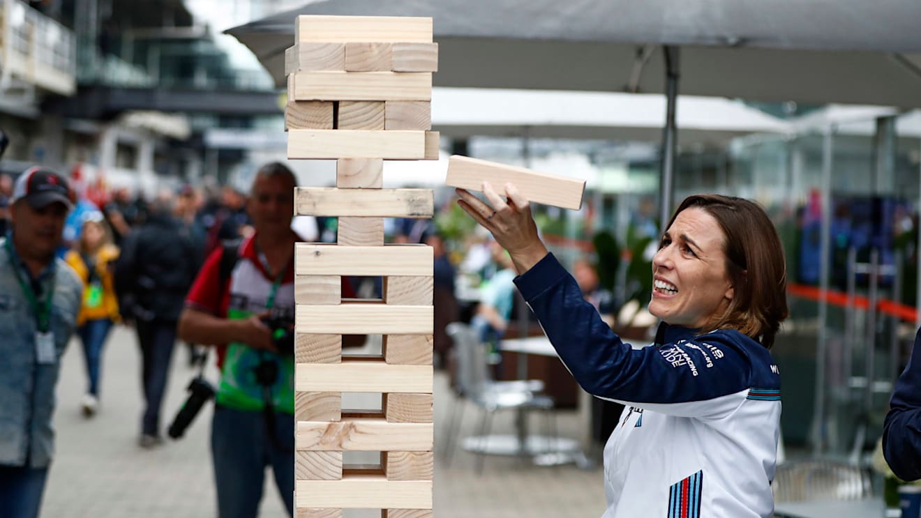 Claire Williams, Deputy Team Principal, Williams Racing, plays a giant Jenga game during the Brazilian GP on November 09, 2018 in Autodromo Jose Carlos Pace, Brazil. (Photo by Glenn Dunbar / LAT Images)