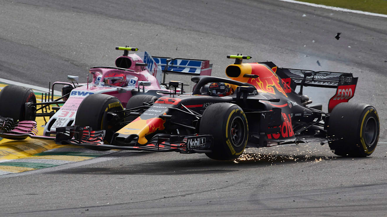 Esteban Ocon, Force India VJM11 Mercedes, collides with race leader Max Verstappen, Red Bull Racing RB14 Tag Heuer during the Brazilian GP on November 11, 2018 in Autodromo Jose Carlos Pace, Brazil. (Photo by Steve Etherington / LAT Images)